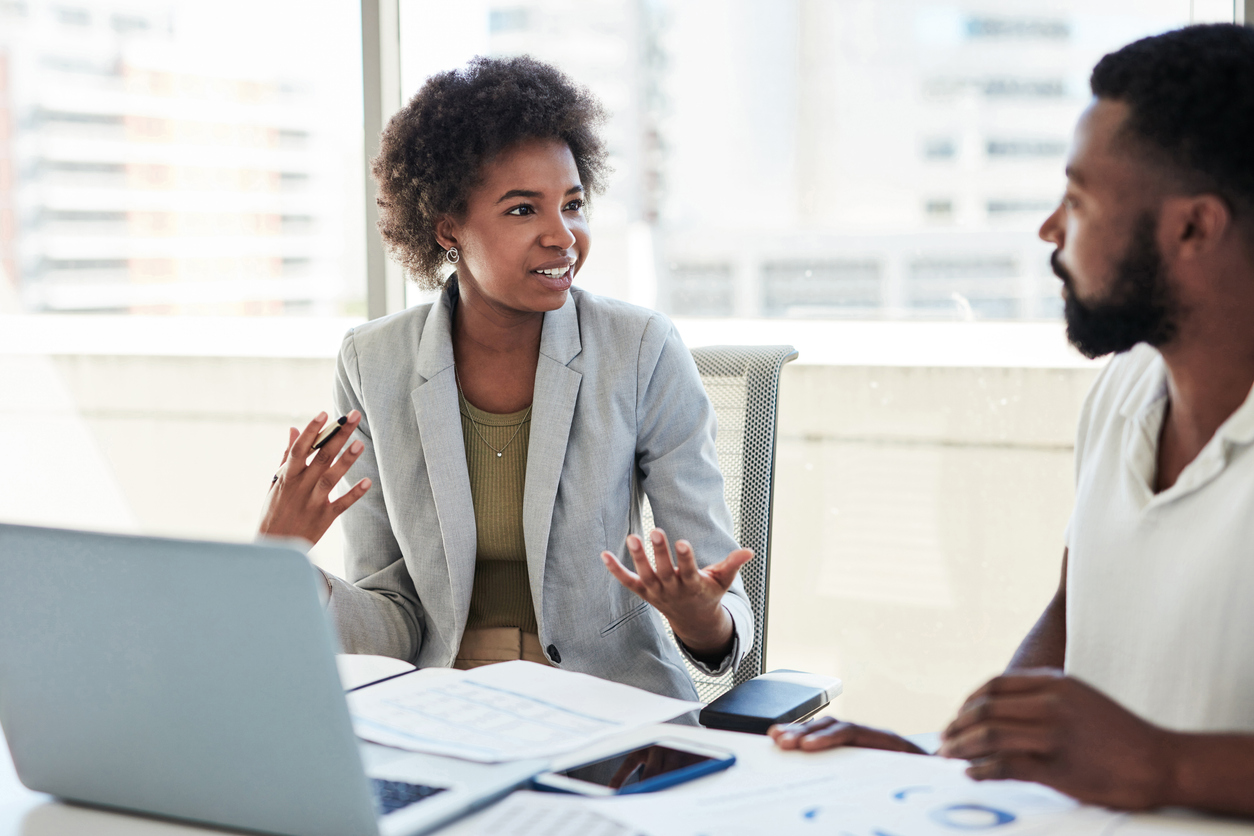 Two Professionals Talking in an Office..jpg