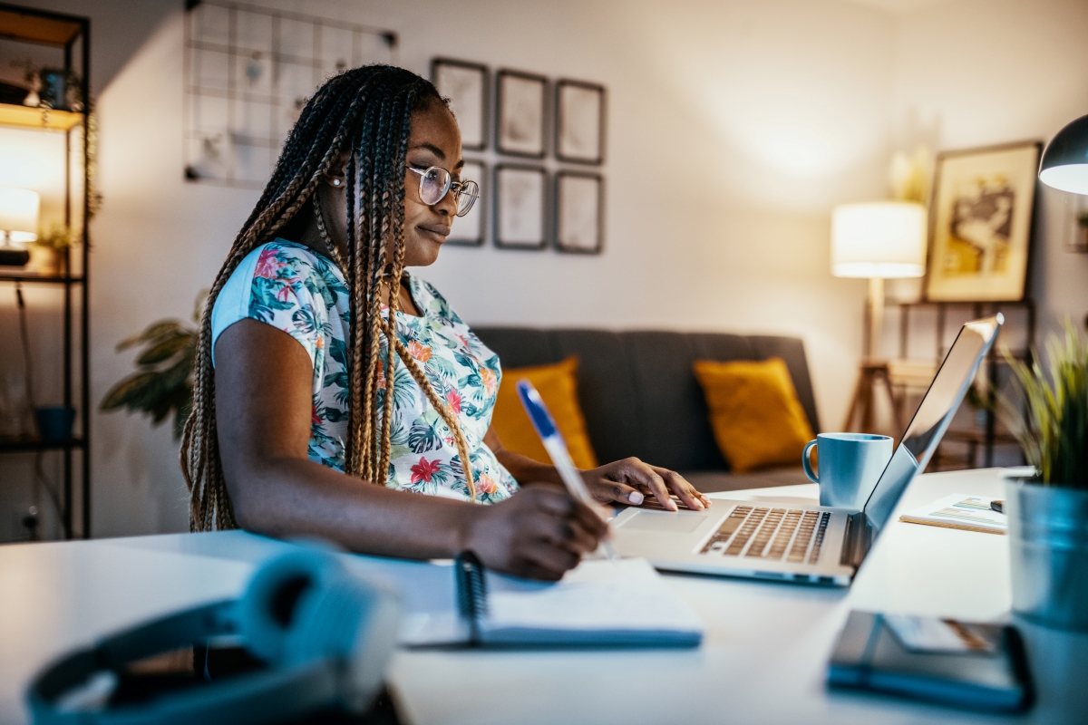 A student working from home on a laptop.